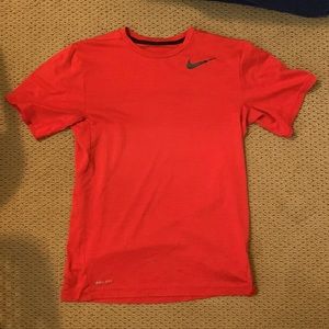 Nike, small red t-shirt.